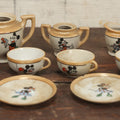 Lot 056 - Grouping Of Eight Vintage Hand Painted Mickey And Minnie Mouse Disney Tea Set Pieces Including Teapot, Creamer, Sugar Bowl, Cups, And Plates, Note Various Chips, Wear, Made In Occupied Japan, Walt Disney Productions