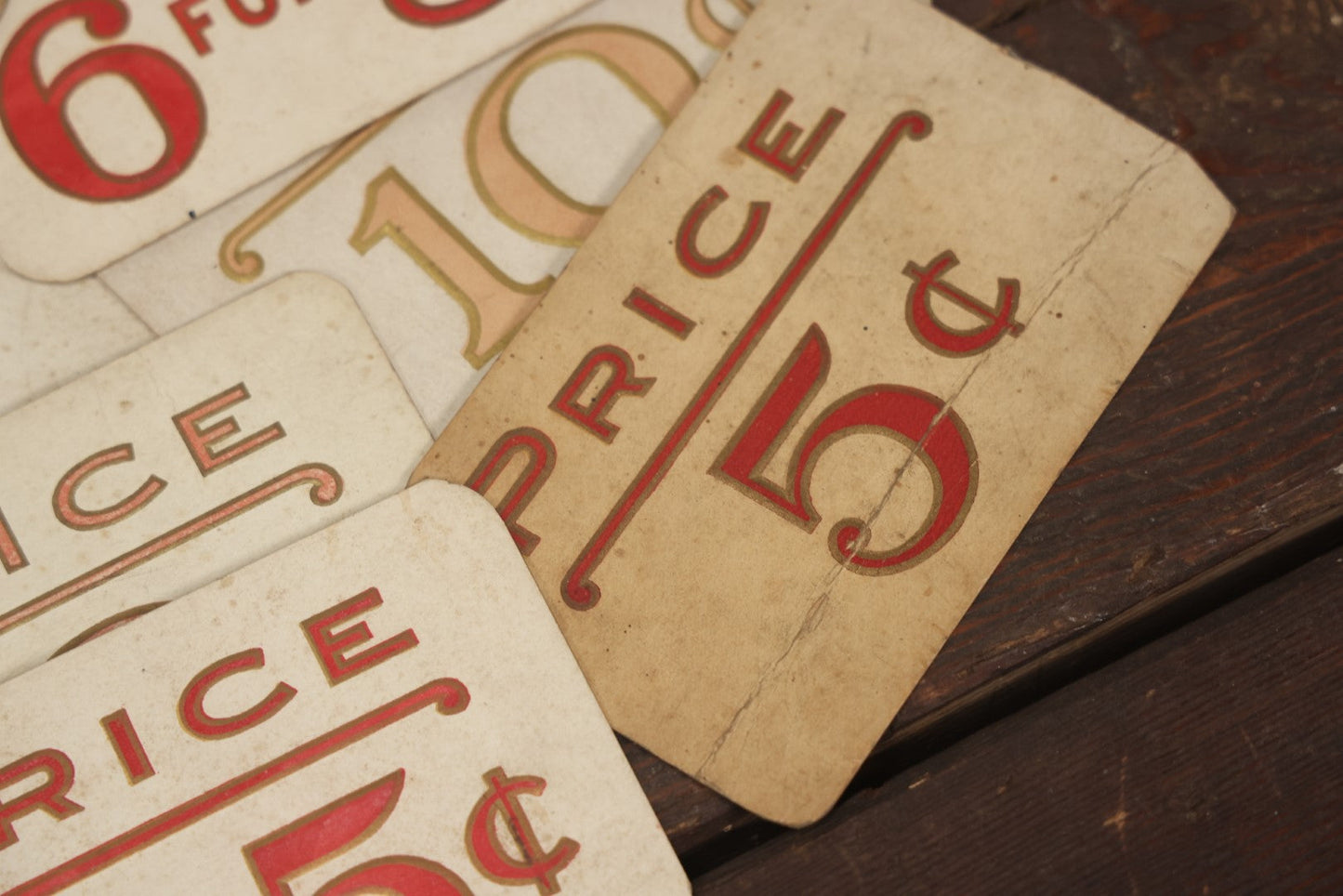Lot 103 - Grouping Of 15 Medium Vintage Five And Dime Store Pricing Labels, 5C, 10C, And More, Embossed, Red Text, Approximately 3-1/2" x 5-1/2"