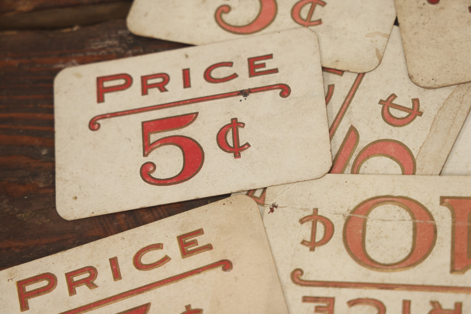 Lot 103 - Grouping Of 15 Medium Vintage Five And Dime Store Pricing Labels, 5C, 10C, And More, Embossed, Red Text, Approximately 3-1/2" x 5-1/2"
