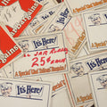 Lot 106 - Grouping Of 35 Larger Vintage Five And Dime Store Pricing Labels, "It's Here!", "A Special 'Glad Tidings' Bargain!" And More, With Man In Cap Mascot, Approximately 7" x 5-1/2"
