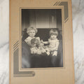 Lot 016 - Vintage Foldered Portrait Photograph Of Two Young Children Holding A Cat On A Sofa, Circa 1938, Robert H. Peters, Photographer, East Holliston, Massachusetts