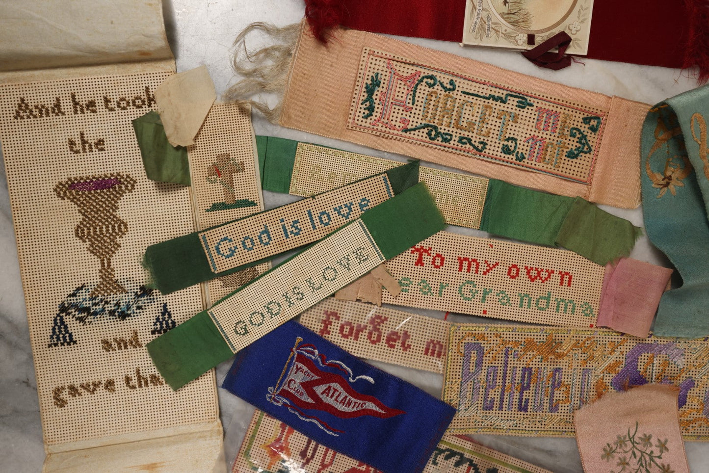 Lot 064 - Grouping Of 10+ Antique Punchwork Punched Paper Embroidered Bookmarks And More, Including Remember Me, God Is Love, Forget Me Not, And More