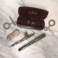 Lot 138 - Junk Drawer Grouping, 5+ Pieces Including Glasses In Case, Two Pens, And More