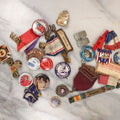 Lot 139 - Junk Drawer Grouping, 20+ Pins And Pinback Buttons, Ribbons And More, Including Athens High School Bulldogs, Gene Autry, Johnson For President, And Others