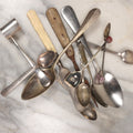 Lot 142 - Junk Drawer Grouping, 10+ Utensils, Spoons, Souvenirs, And More, Including Bone Handled Butter Knife, Etc