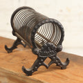 Lot 208 - Vintage Cast Iron Letter Spring Coil Letter Holder With Legs, Boots, By K. Diamond
