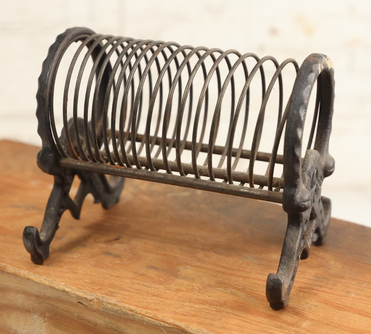 Lot 208 - Vintage Cast Iron Letter Spring Coil Letter Holder With Legs, Boots, By K. Diamond
