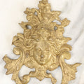 Lot 070 - Antique Cast Metal Gold Painted Fragment With Woman / Goddess' Head, With Ornate Design, Likely A Piece Of A Clock Or Other Decor Item