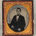 Lot 102 - Antique 1/6th Plate Ruby Ambrotype Photograph Of A Young Man With A Wide Bowtie In A Wooden Wall Hanging Half Case