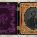 Lot 103 - Antique 1/6th Plate Ruby Ambrotype Of Young Man With Small Beard, In Thermoplastic Case, Note Purple Pillow Added, Not Original