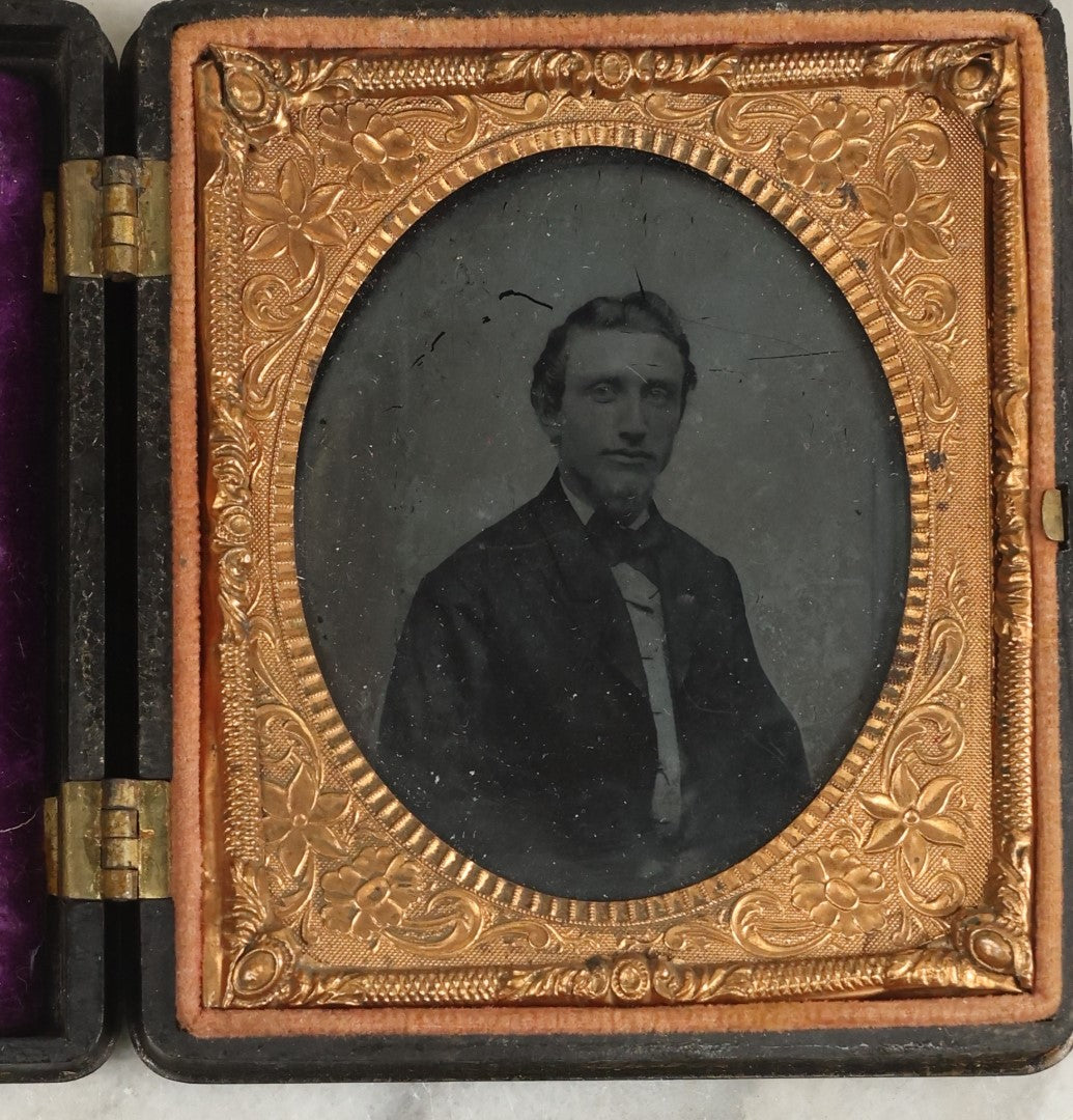 Lot 103 - Antique 1/6th Plate Ruby Ambrotype Of Young Man With Small Beard, In Thermoplastic Case, Note Purple Pillow Added, Not Original