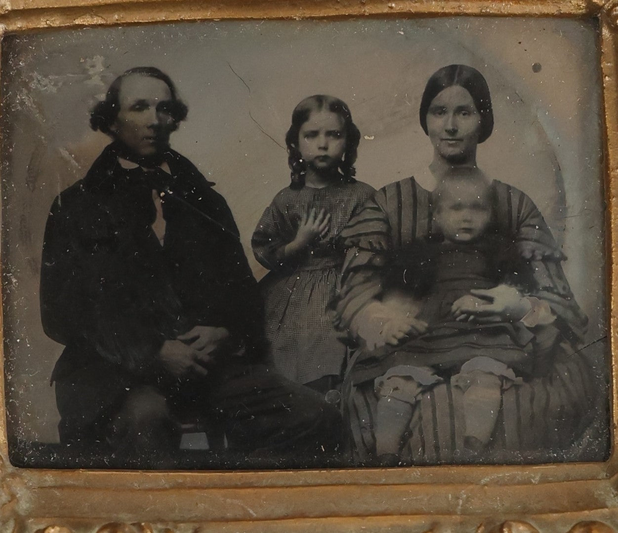 Lot 104 - Antique 1/6th Plate Ambrotype Of A Family, Mother, Father, Daughter, And Small Child, In Custom Gesso Frame