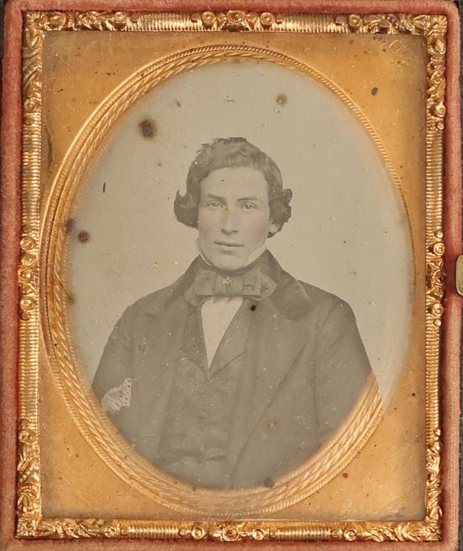 Lot 108 - Antique 1/9th Plate Ambrotype Of A Handsome Young Man, Note Compass And Square Brooch On Bowtie, Likely A Mason, In Thermoplastic Case