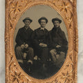 Lot 117 - Antique Larger Size, Approximately 1/4 Plate Matted Tintype Photograph Of Three Young Men In Hats, Middle Man Smiling