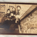 Lot 121 - Antique Long Cabinet Card Photograph Of Four Well Dressed Women Sitting On Front Stoop Steps In Front Of A Door With Interesting Perspective, Brick Wall In Foreground, Low Angle