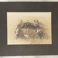 Lot 125 - Early Selfie, Antique Boarded Photograph Of A Group Of Men, Hikers, Forming An H On The Ground, With Hiker Flag On Grass, Note Man Left Center Pulling String To Operate The Shutter, Take Photo