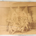 Lot 126 - Antique Boarded Group Photo, Very Poor Condition, Many Losses And Breaks, Of A German Fraternal Or Military Organization, With Many Flags And Regalia, Men Holding Mugs Of Beer (Note Man From Lot 123, Left Side Middle Row)