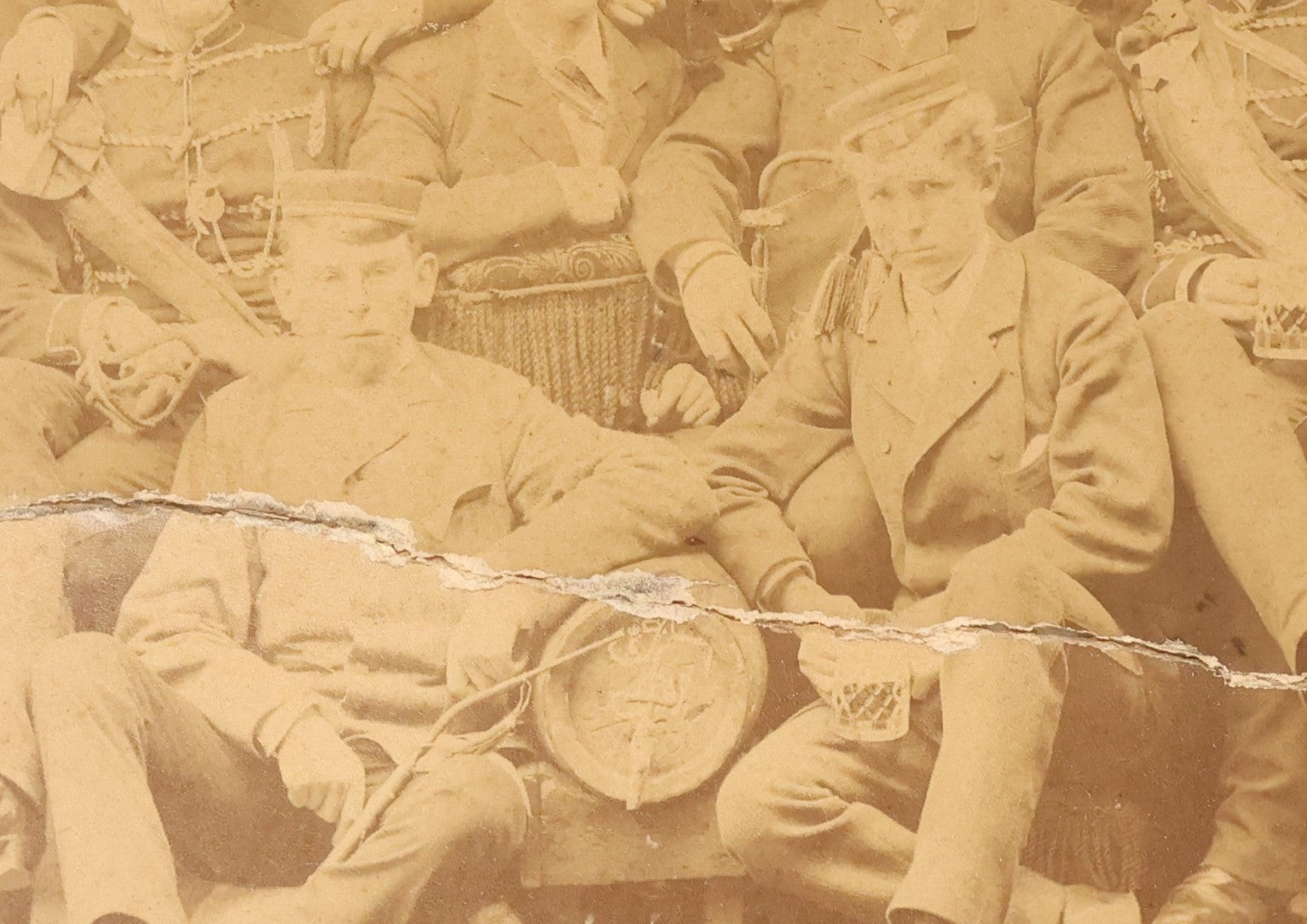 Lot 126 - Antique Boarded Group Photo, Very Poor Condition, Many Losses And Breaks, Of A German Fraternal Or Military Organization, With Many Flags And Regalia, Men Holding Mugs Of Beer (Note Man From Lot 123, Left Side Middle Row)