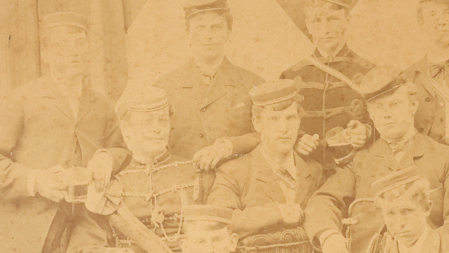 Lot 126 - Antique Boarded Group Photo, Very Poor Condition, Many Losses And Breaks, Of A German Fraternal Or Military Organization, With Many Flags And Regalia, Men Holding Mugs Of Beer (Note Man From Lot 123, Left Side Middle Row)