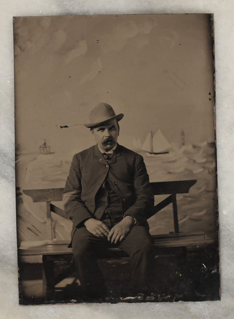 Lot 132 - Grouping Of Fifteen Antique Tintype Photographs Of Men, Including Old Man With White Hair And Grin, Bearded Man In Hat, Man With Large Mustache, Man With Nautical Backdrop, And Others