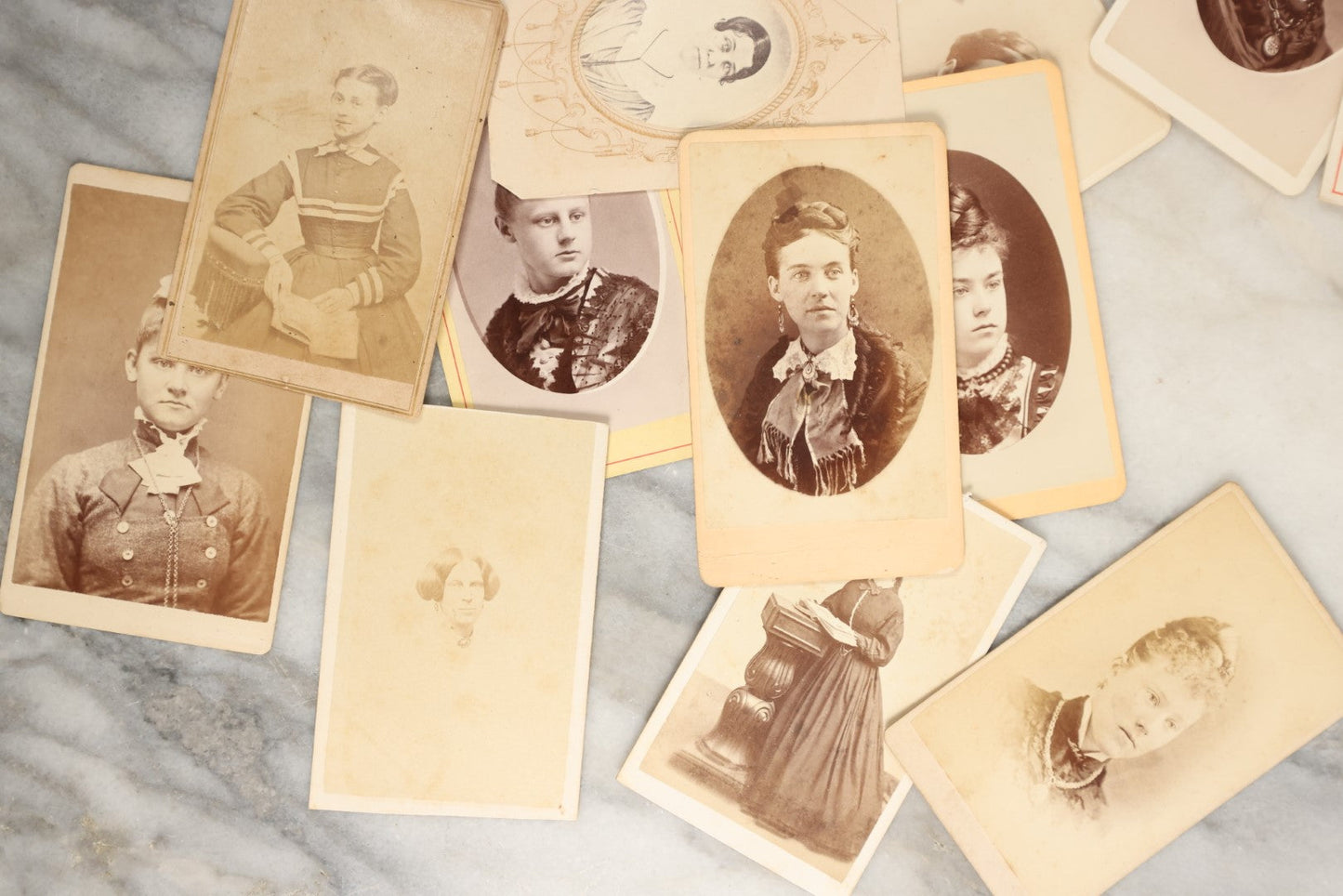 Lot 138 - Grouping Of 35+ Antique Carte De Visite C.D.V. Photographs Of Women And Girls, Including Many With Extravagant Books And Dress, Women Holding Book, Interesting Hairstyles, And More