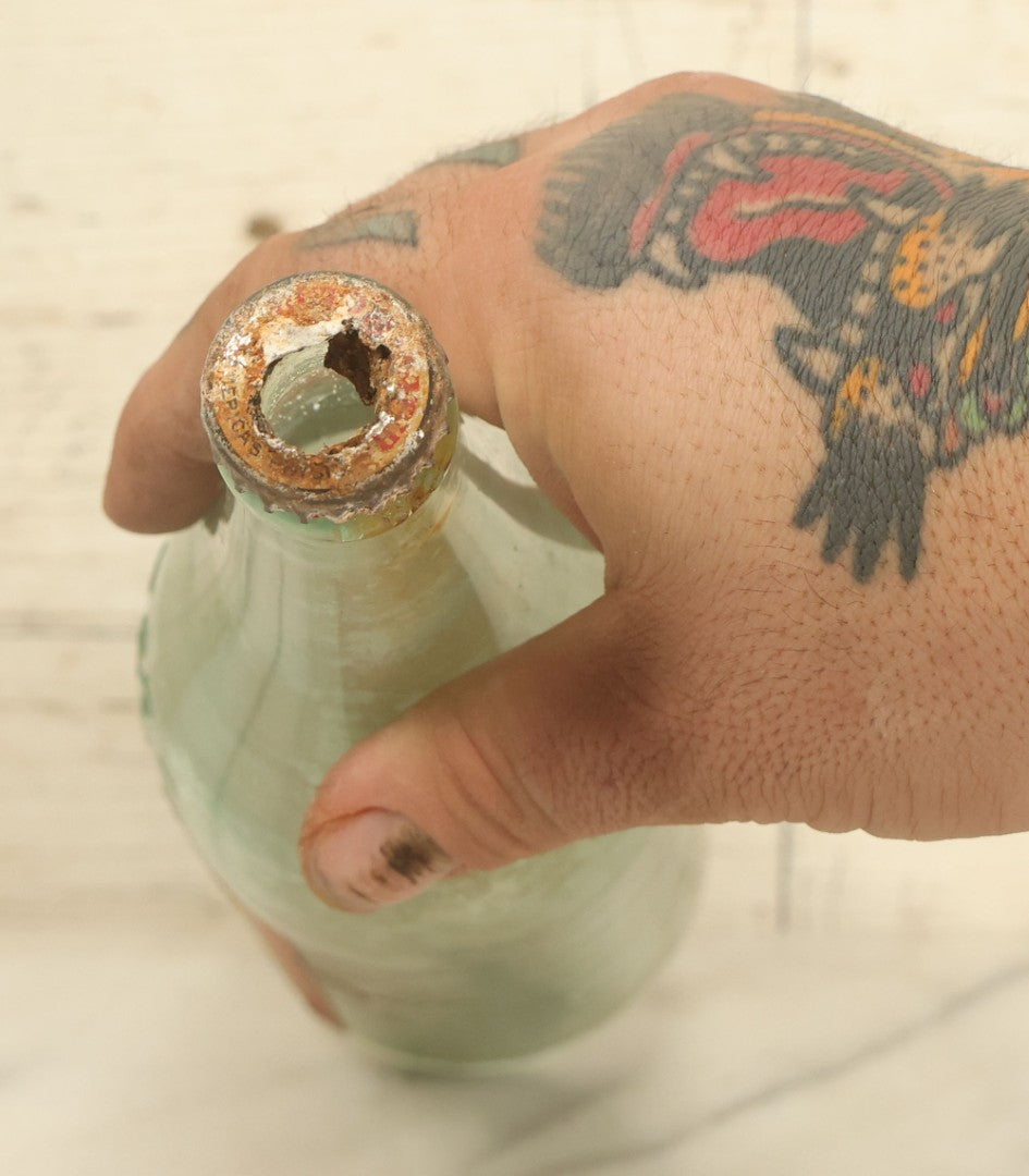 Lot 005 - Antique Pluto Water Glass Bottle With Original Paper Label, Devil Graphics, French Lick Springs Hotel Co., French Lick, Indiana, With Embossed Devil On Bottom, Drilled Cap