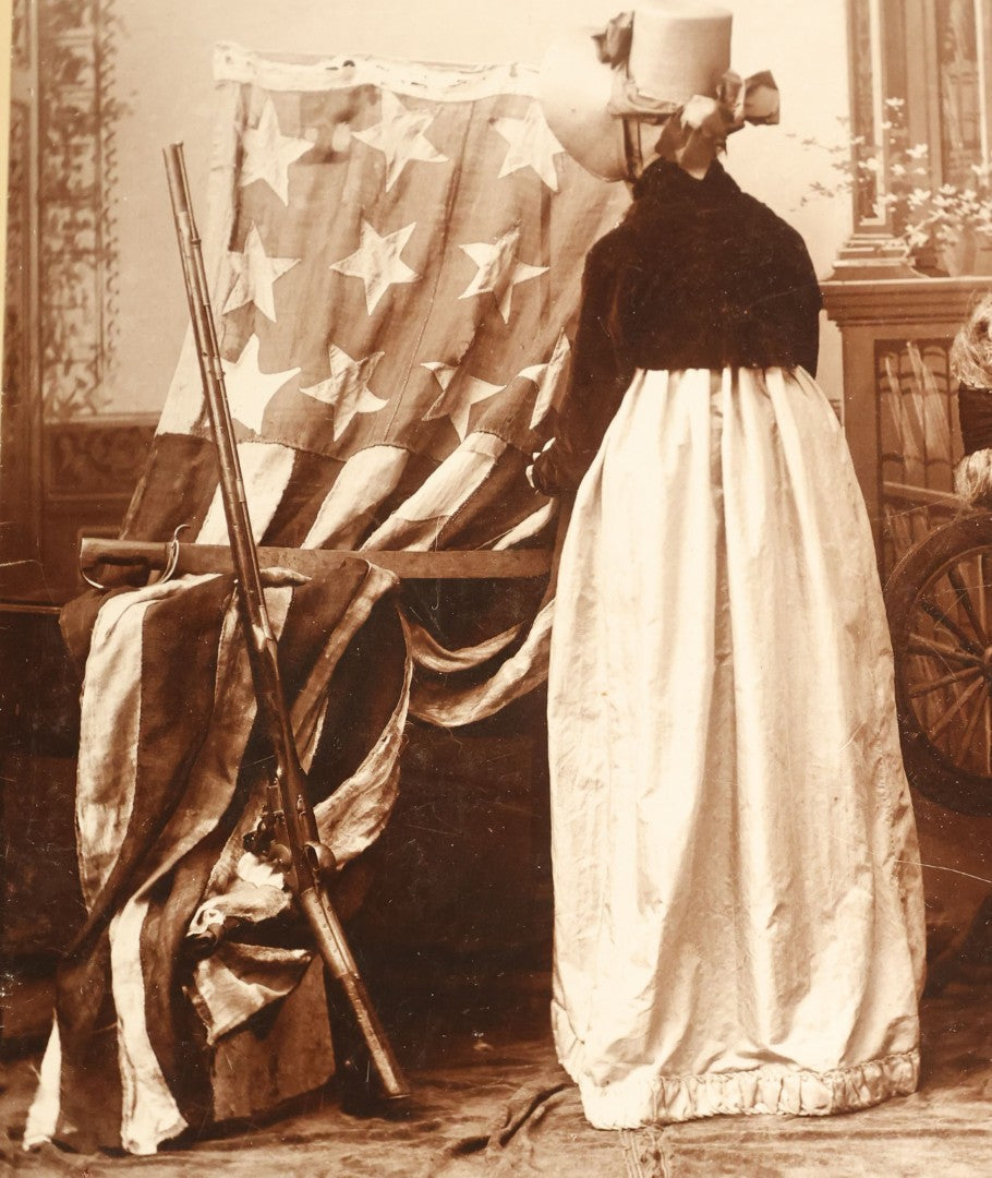 Lot 070 - Pair Of Large Size Antique Cabinet Card Photographs Of An Elderly Woman Posing With A Large Hand Sewn American Flag, Rifle, Possible American Revolution Connection Or Centennial, Chamberlain, Photographer, Rhode Island And Massachusetts