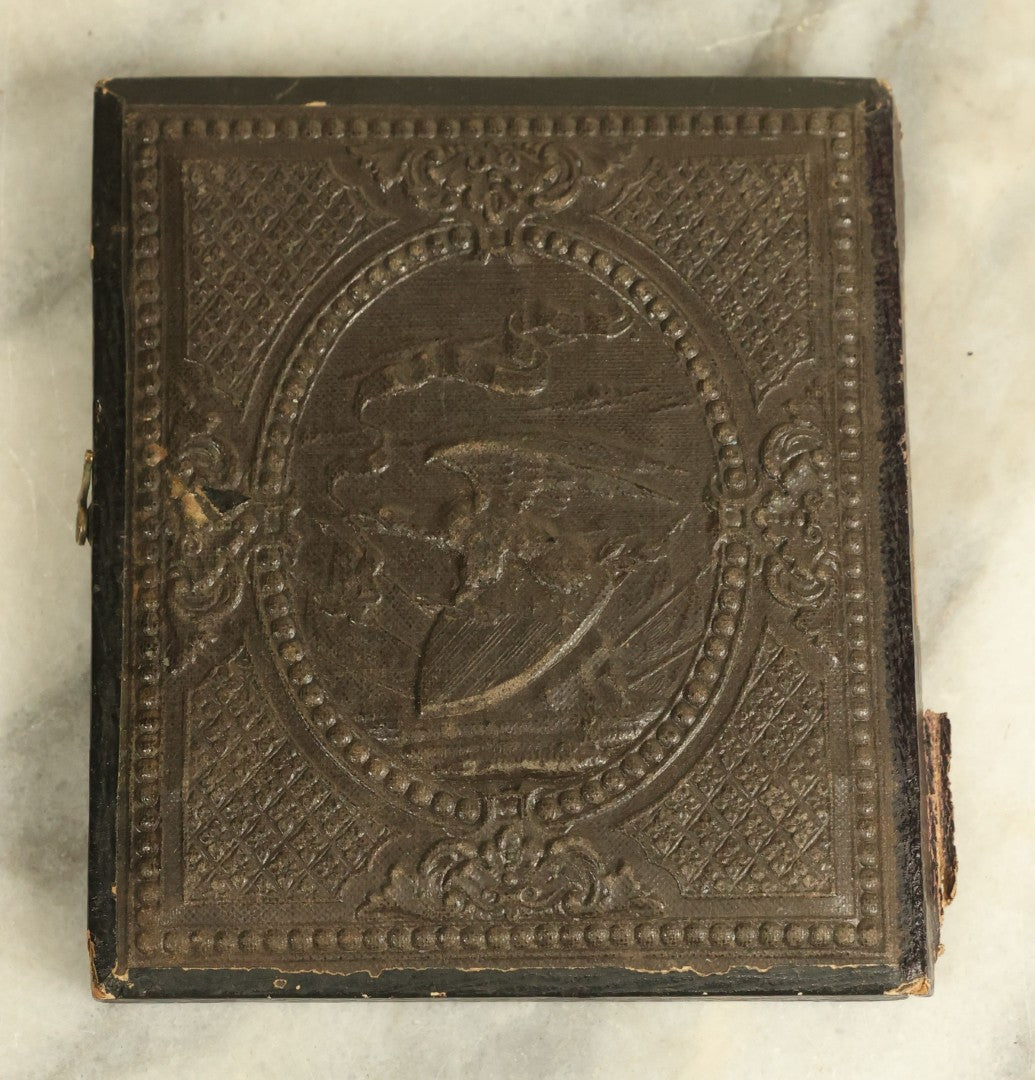 Lot 071 - Antique 1/6th Plate Ambrotype Photograph Of A Pair Of Friends With Linked Arms, In Half Leatherette Union Case With Patriotic Eagle Motif, Case Not Original To Photo