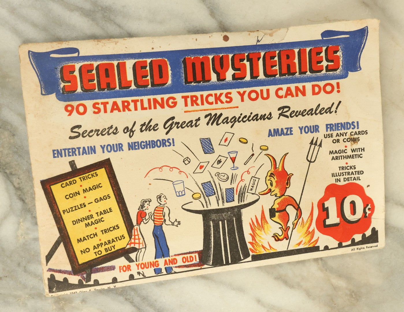 Lot 117 - Vintage Sealed Mysteries Novelty Magic Trick Mailer With Devil Graphics On Envelope, 90 Startling Tricks, Copyright 1943, Glen E. Towns, New York City
