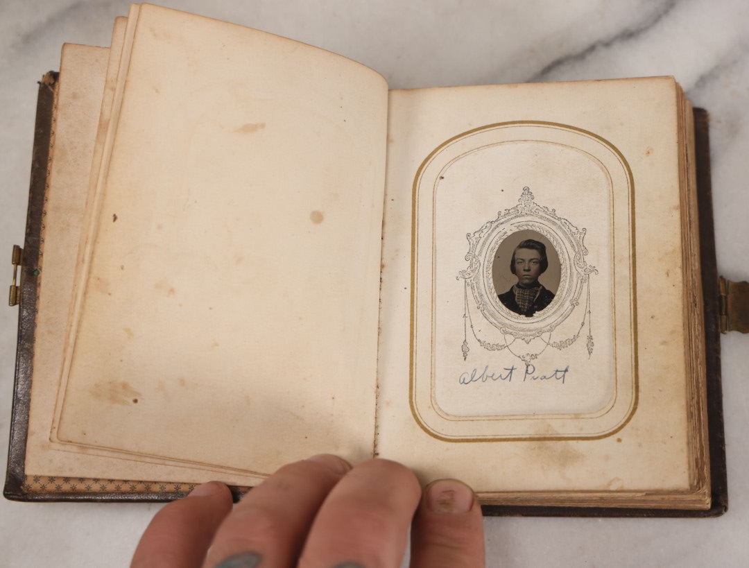 Lot 064 - Antique Family Photo Album Containing 16 Tintypes And 7 Carte De Visite C.D.V. Photographs, Mostly Portraits Of The Pratt And Hobbs Families, Many Identified, Mostly Full 
