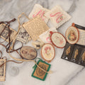 Lot 098 - Mixed Grouping Of Small Religious Items Including Jesus, Mary, And Joseph Miniature Metal Statues, Coins, Etc.