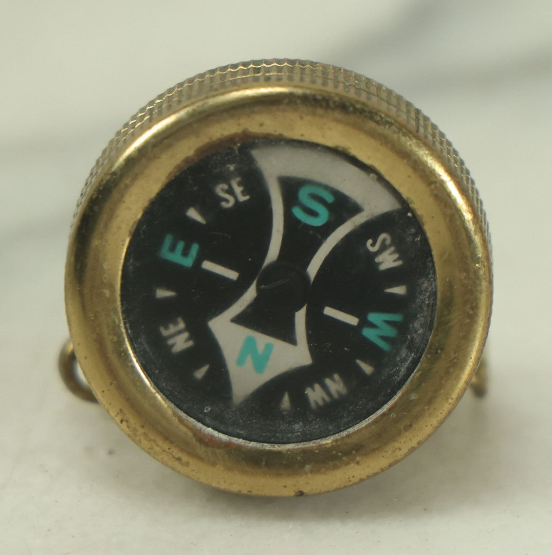 Lot 140 - Vintage Pin On Brass Miniature Compass With Black Light Sensitive Glow In The Dark Letters