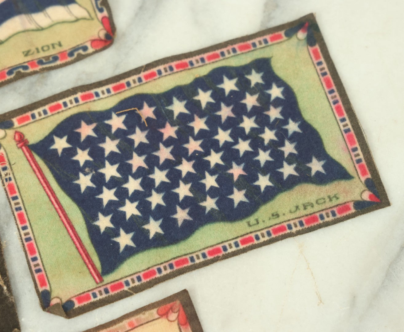 Lot 141 - Grouping Of Seven Antique Tobacco Felt Country Flags Including The United States Jack, France, Austria Hungary, Zion, Belgium, Germany, And France