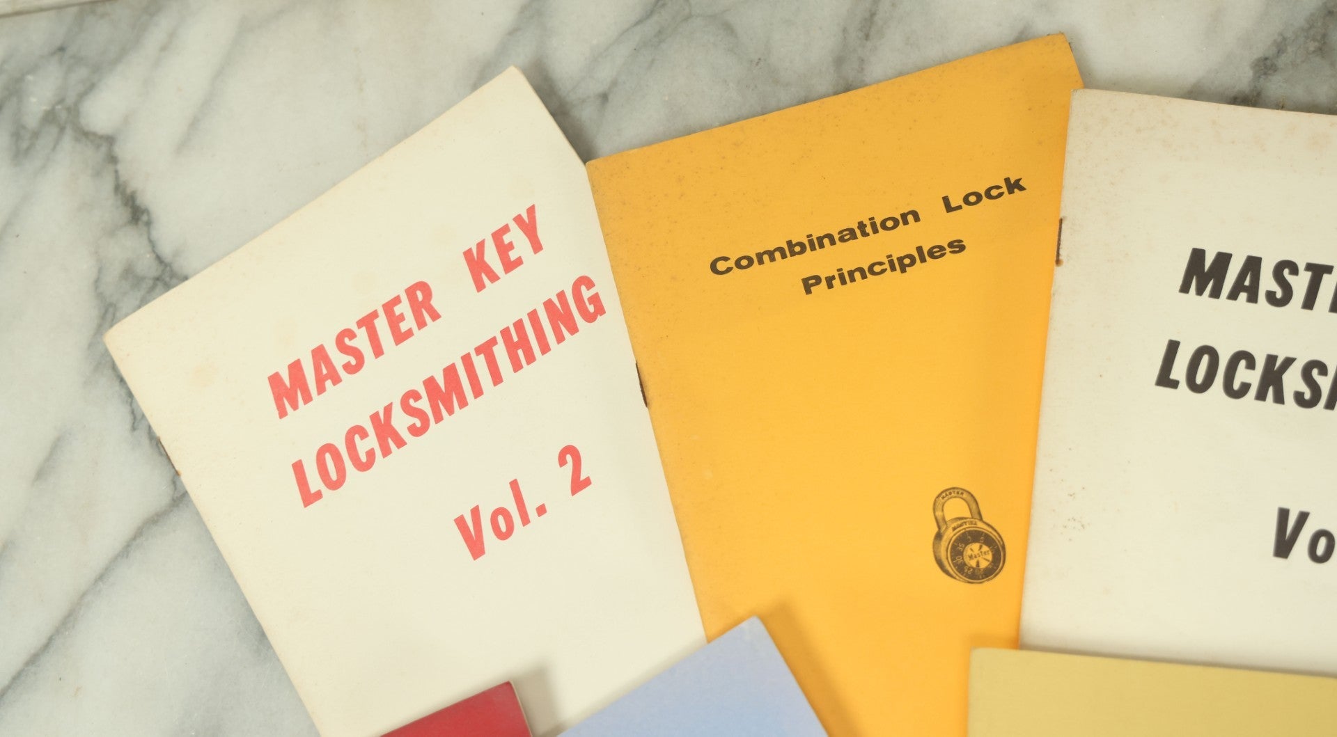 Lot 094 - Grouping Of Seven Booklets On Handcuffs And Locksmithing, Including How To Open Handcuffs Without Keys, Lock Picking, Etc., By Desert Publications, Late 1970s