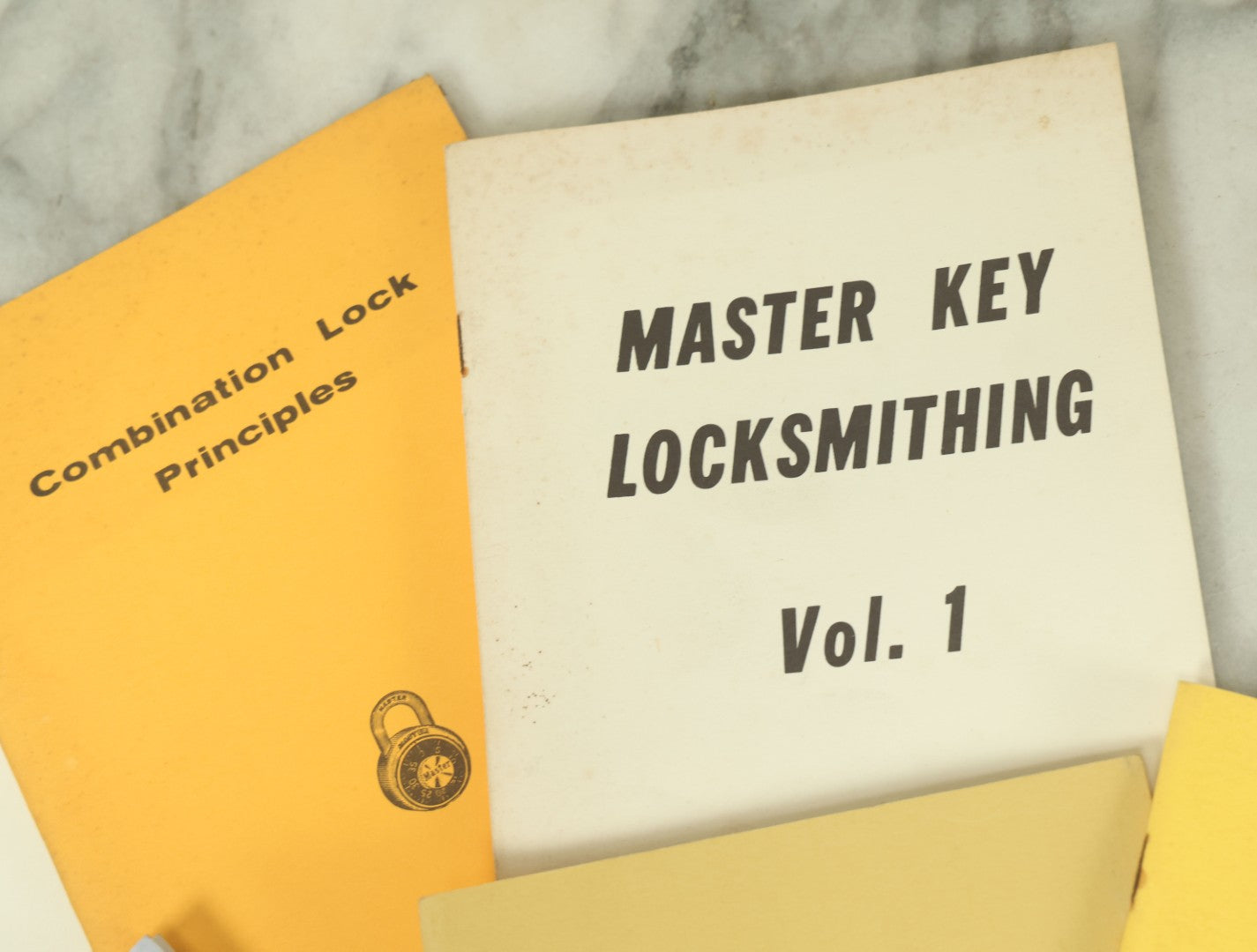 Lot 094 - Grouping Of Seven Booklets On Handcuffs And Locksmithing, Including How To Open Handcuffs Without Keys, Lock Picking, Etc., By Desert Publications, Late 1970s