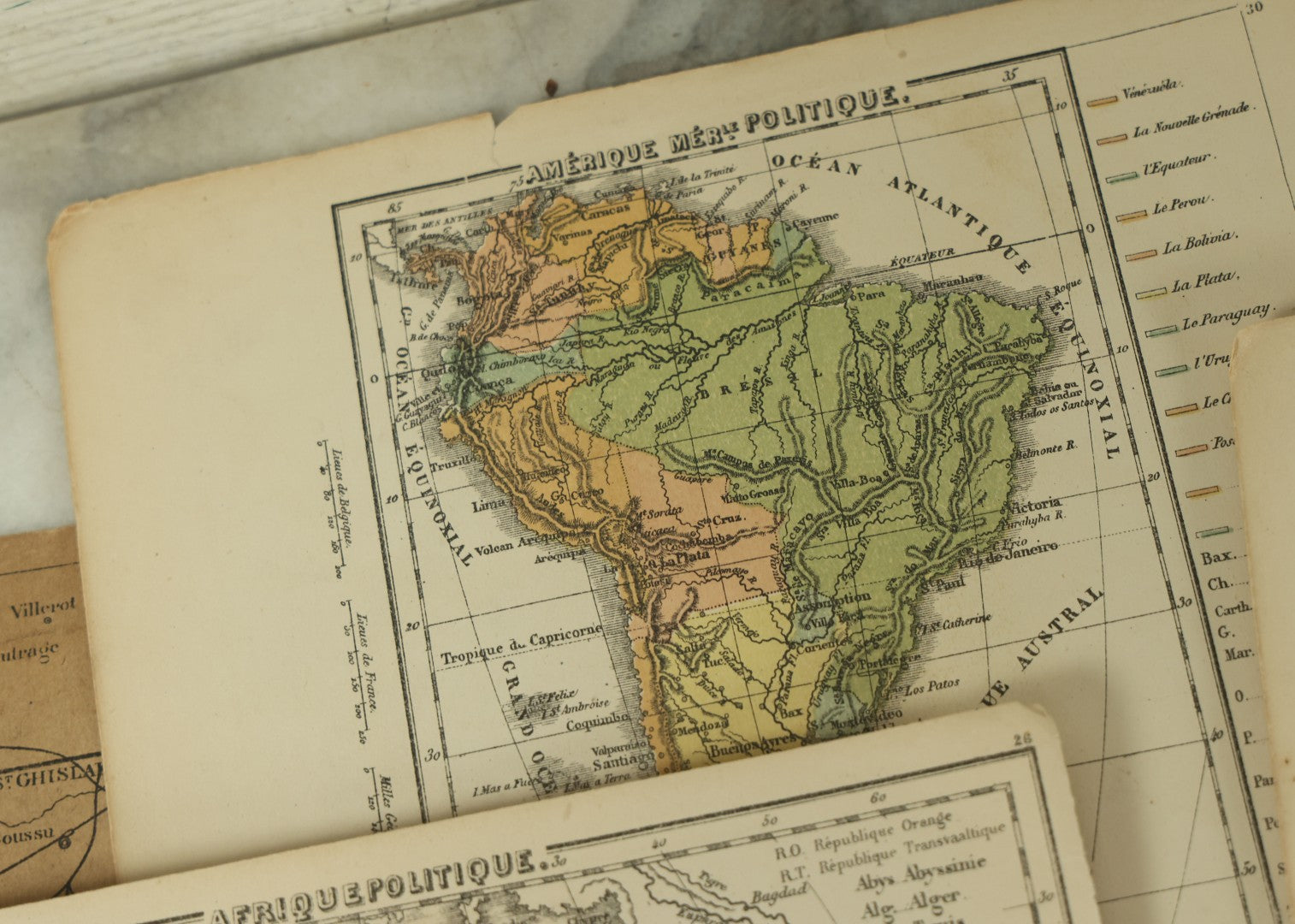 Lot 096 - Grouping Of 10+ Pages From An Antique French Atlas, Including A Diagram Of The Solar System, Maps Of Europe, The America's, Etc.