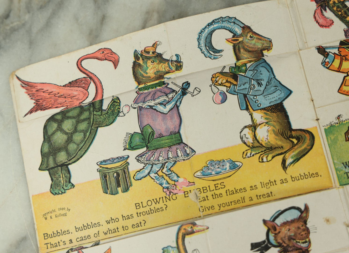 Lot 097 - Antique Kellogg's Cereal Advertising Book, "Funny Jungleland Moving Pictures" With Anthropomorphic Animals, Pages Flip To Mix And Match Heads, Outfits, Bodies, Copyright 1909 By W.K. Kellogg, Battle Creek, Michigan