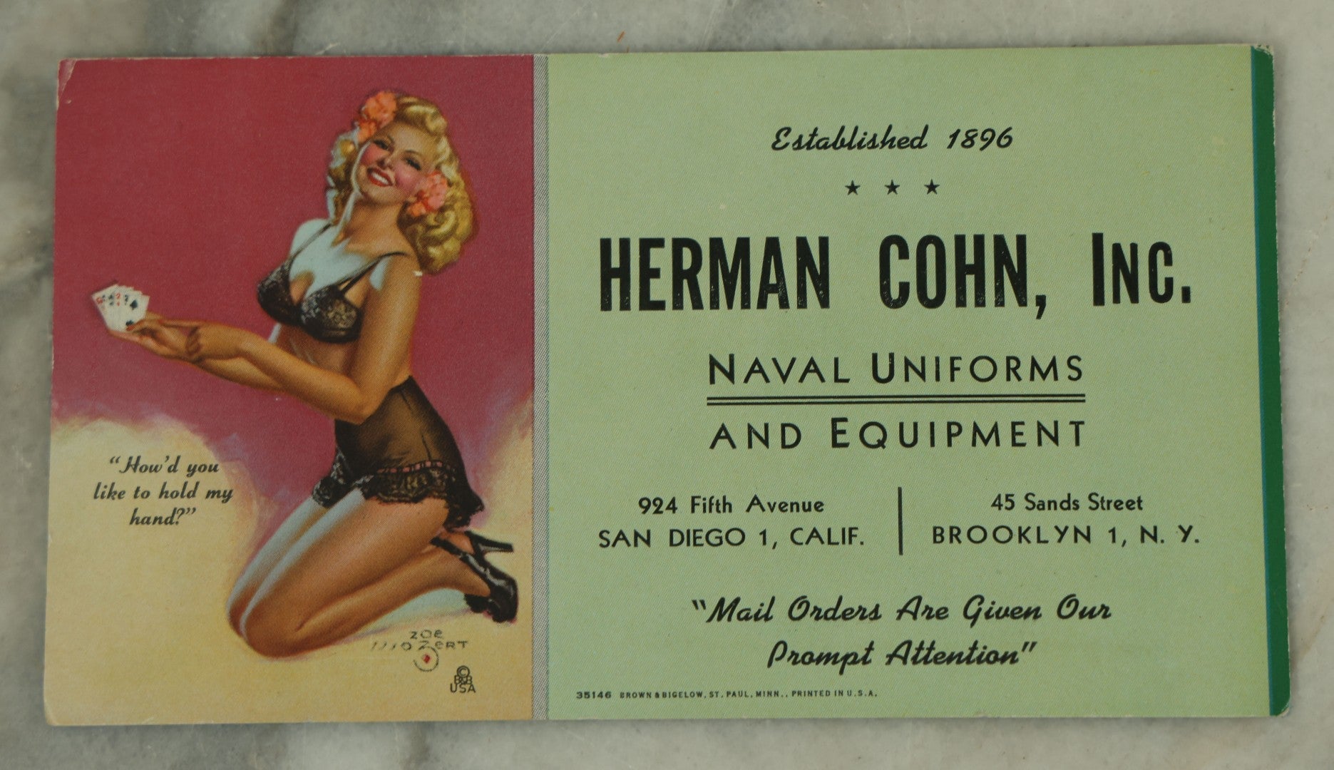Lot 109 - Three Piece Ephemera Grouping Including Pinup Blotter For Herman Cohn, Inc Naval Uniforms, Vogue Cigarette Papers, And Joan Bennett Movie Star Card
