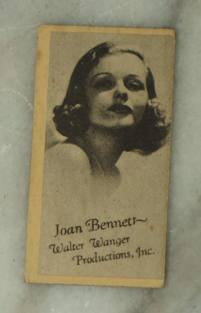 Lot 109 - Three Piece Ephemera Grouping Including Pinup Blotter For Herman Cohn, Inc Naval Uniforms, Vogue Cigarette Papers, And Joan Bennett Movie Star Card