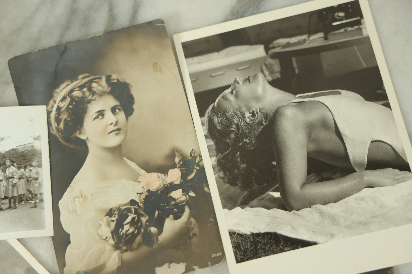 Lot 115 - Grouping Of Ten Vintage And Antique Snapshot And Real Photo Postcard Photos Of Women And Girls Including Nuns, Pin-Ups, Old Lady, Girls In Costumes, Etc.