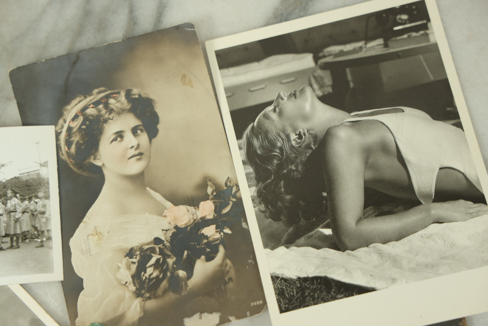 Lot 115 - Grouping Of Ten Vintage And Antique Snapshot And Real Photo Postcard Photos Of Women And Girls Including Nuns, Pin-Ups, Old Lady, Girls In Costumes, Etc.