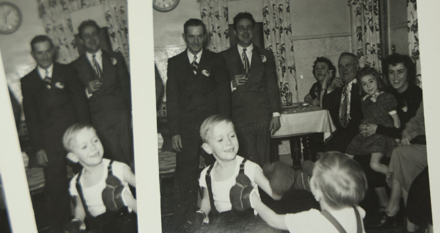Lot 116 - Grouping Of Four Identical Snap Shot Photographs Of Two Young Boys Play Boxing With Gloves While Amused Family Members Look On