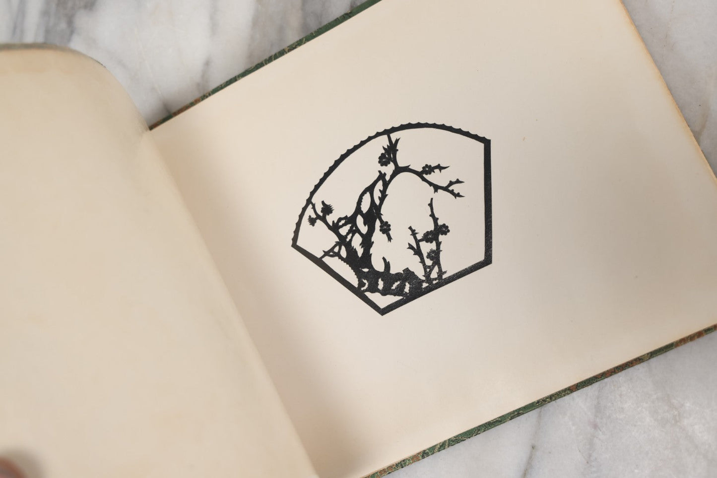 Lot 120 - Vintage East Asian Cloth Covered Art Book With Black Paper Cut Silhouettes