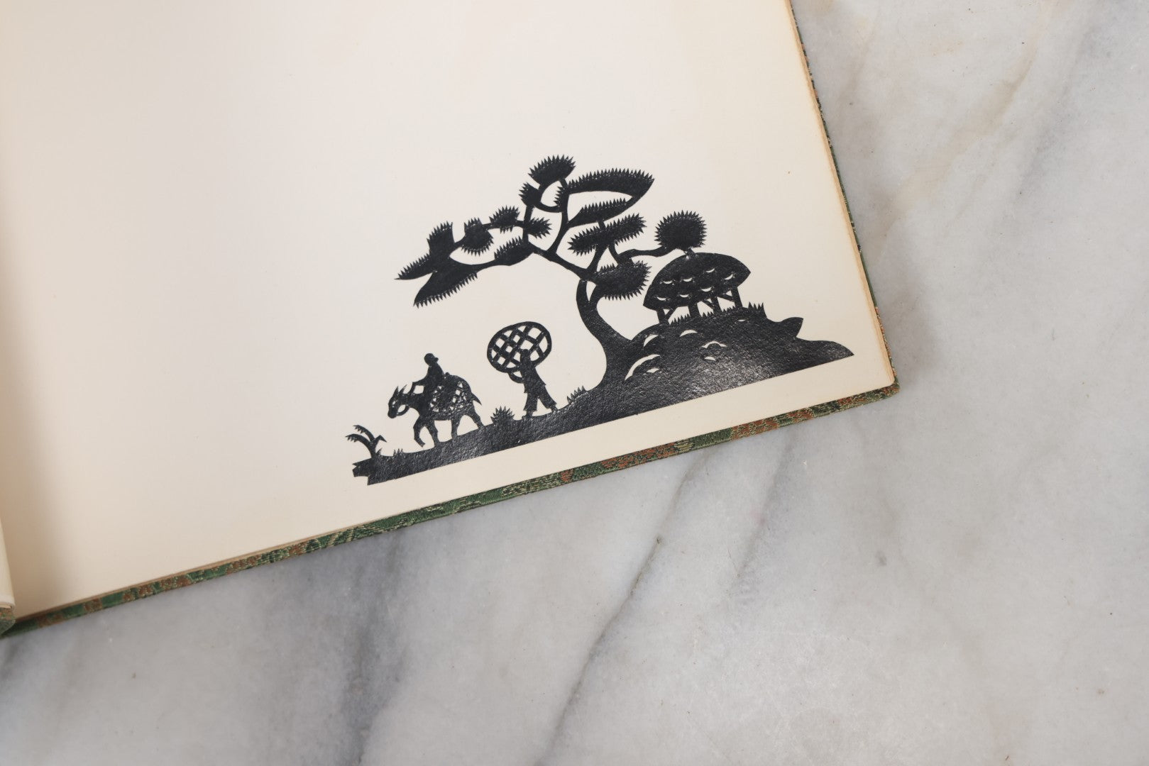 Lot 120 - Vintage East Asian Cloth Covered Art Book With Black Paper Cut Silhouettes