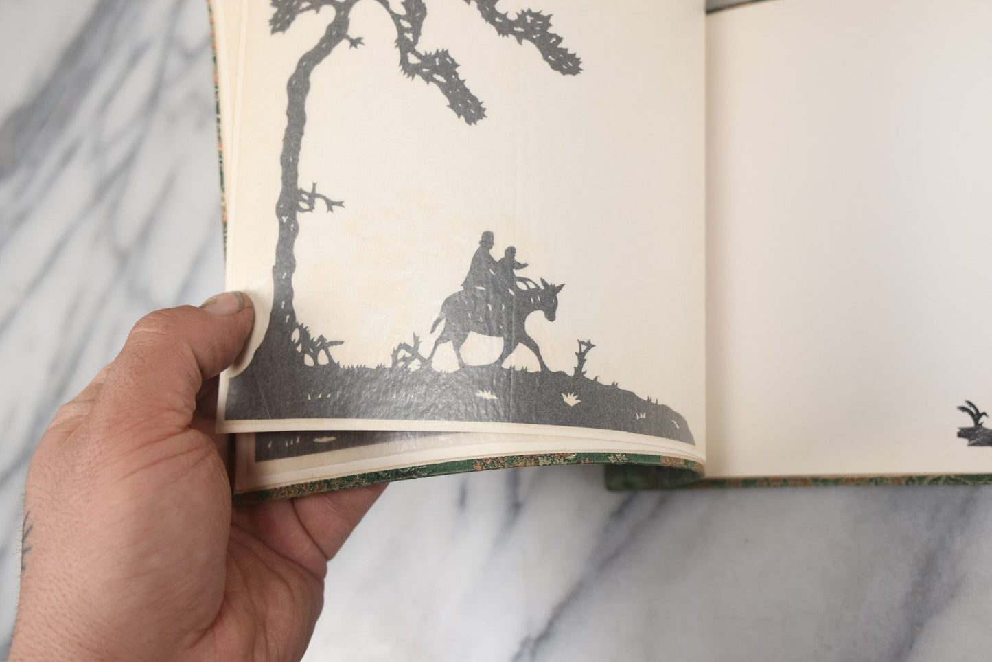 Lot 120 - Vintage East Asian Cloth Covered Art Book With Black Paper Cut Silhouettes