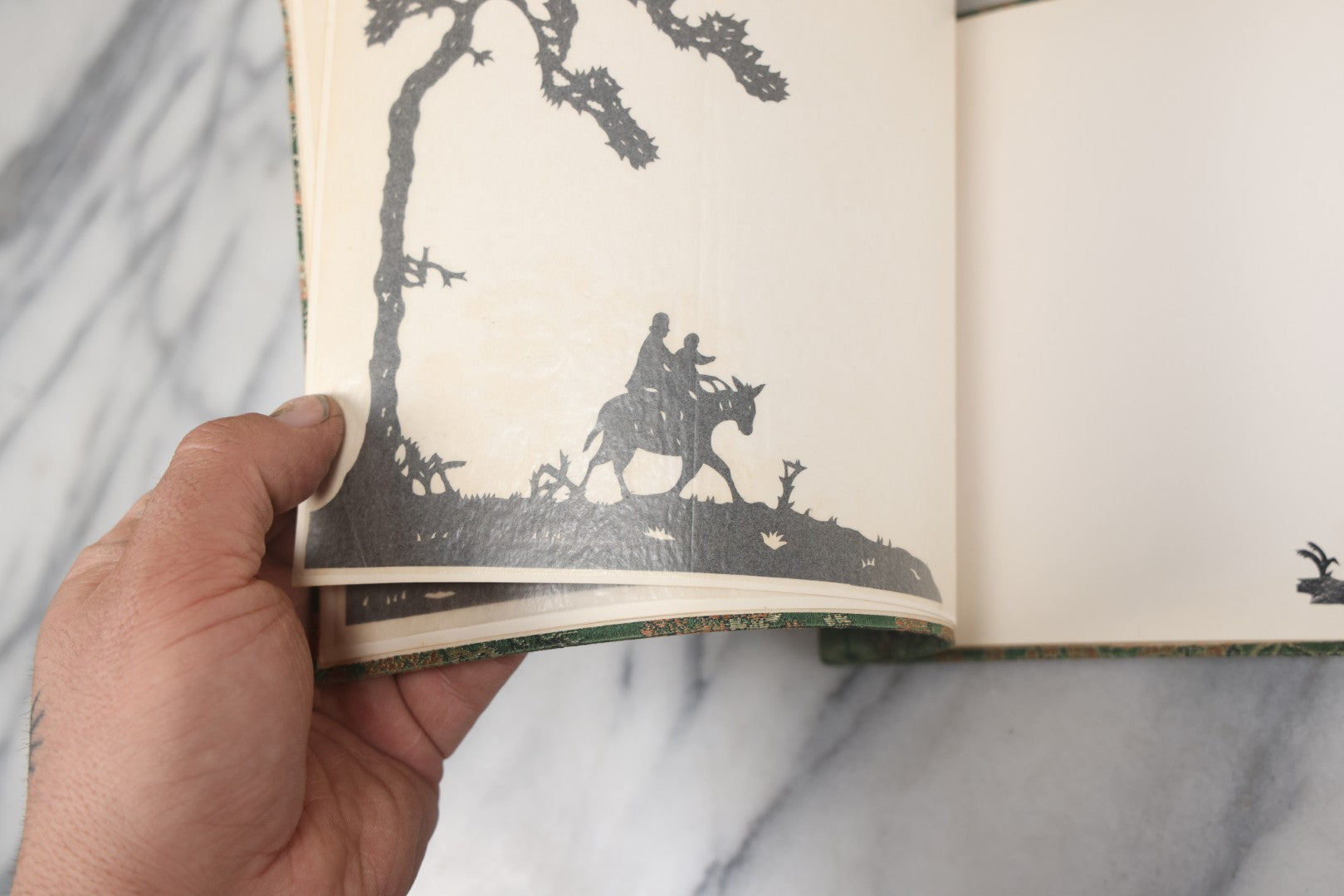 Lot 120 - Vintage East Asian Cloth Covered Art Book With Black Paper Cut Silhouettes