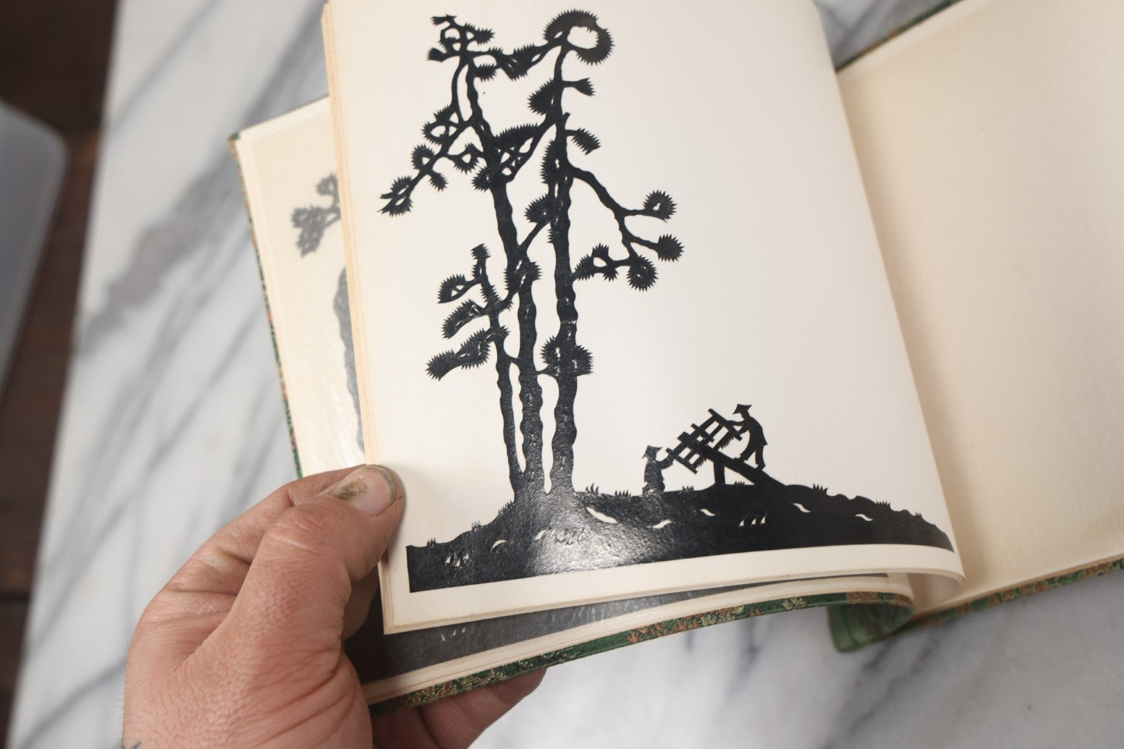 Lot 120 - Vintage East Asian Cloth Covered Art Book With Black Paper Cut Silhouettes