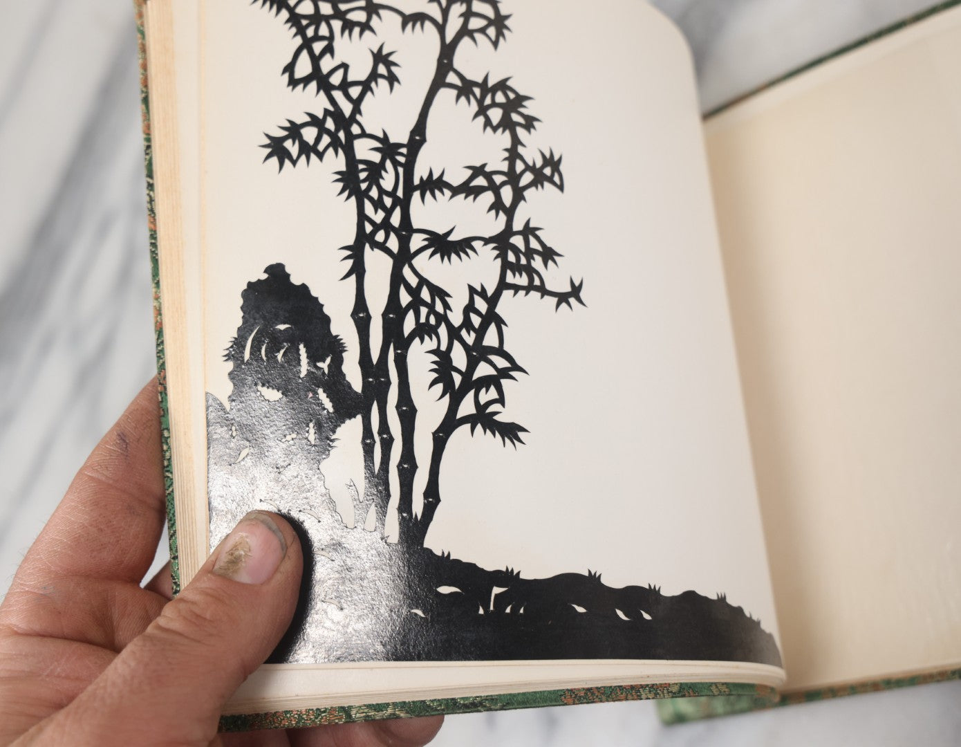 Lot 120 - Vintage East Asian Cloth Covered Art Book With Black Paper Cut Silhouettes