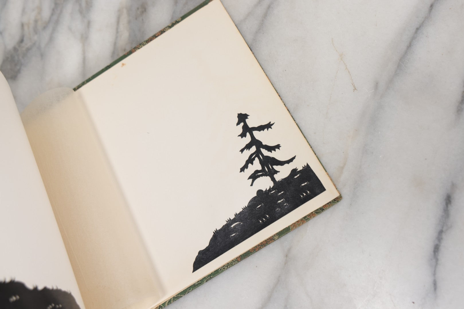 Lot 120 - Vintage East Asian Cloth Covered Art Book With Black Paper Cut Silhouettes