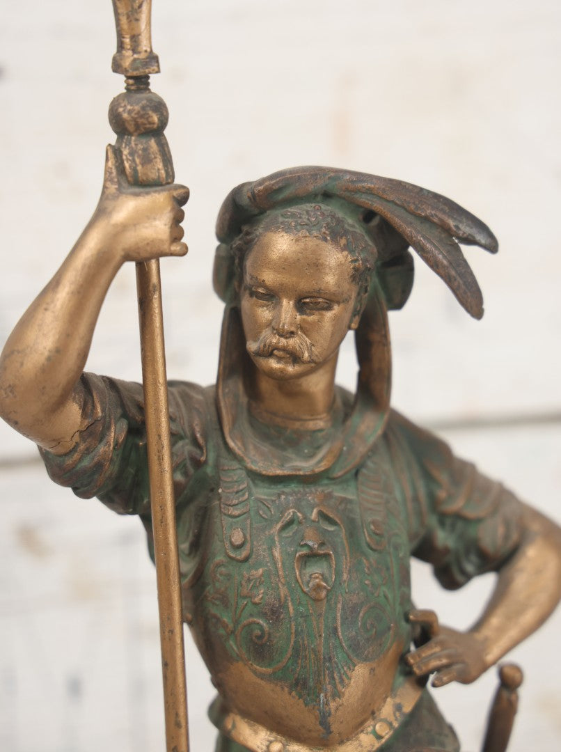 Lot 012 - Antique Cast Metal Statue Of A Soldier In Armor Holding A Spear, Note Green Man On Chest, Patinated, Gilded Finish, 16-1/8" Overall Height